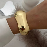 Punk Vintage Irregular chunky shiny gold cuff bangle bracelet on wrist