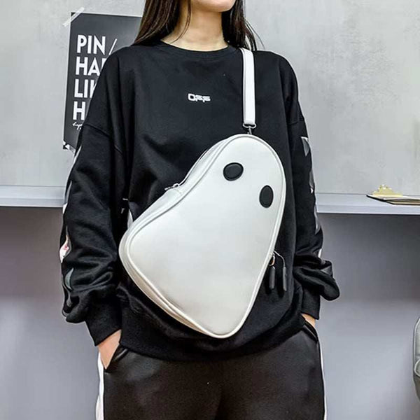 Halloween cartoon ghost shaped white crossbody bag worn with black outfit