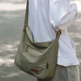 Japanese unisex casual olive green shoulder bag with adjustable strap and front pocket