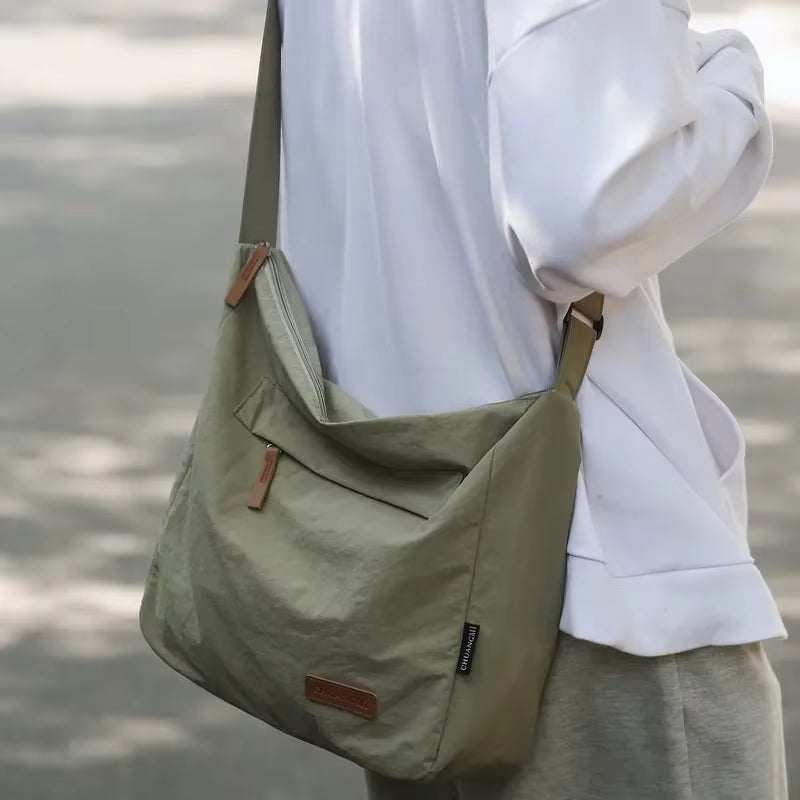 Japanese unisex casual olive green shoulder bag with adjustable strap and front pocket