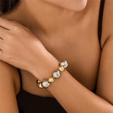 Goth vintage large CCB bead chain bracelet in gold and silver colors on wrist