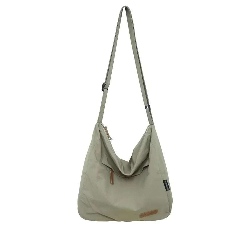Minimalist Japanese Women Men Shoulder bag in beige with adjustable strap and zipper closure