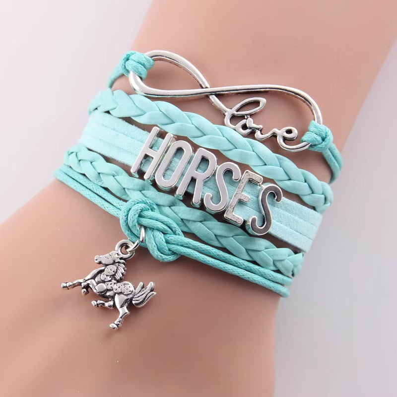 Infinity Love Horses bracelet with turquoise leather braid and silver horse charm on wrist