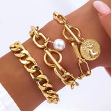 Gold imitation pearl chain bracelets with coin charm and chunky links on wrist