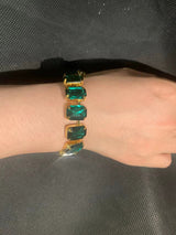 Big rectangle stone rhinestone bracelet with green crystals on wrist